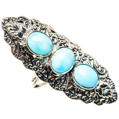 Sterling silver oval cabochon ring with three turquoise-blue stones, ornate side details