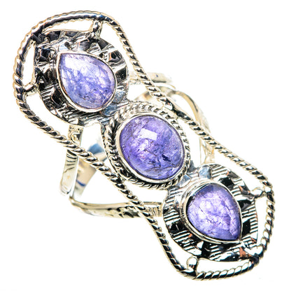 Sterling silver ring with three oval purple tanzanite-style gemstones, braided bezel links