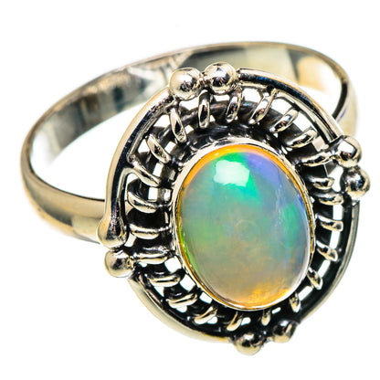Natural Ethiopian opal ring with oval rainbow stone, detailed sterling silver setting
