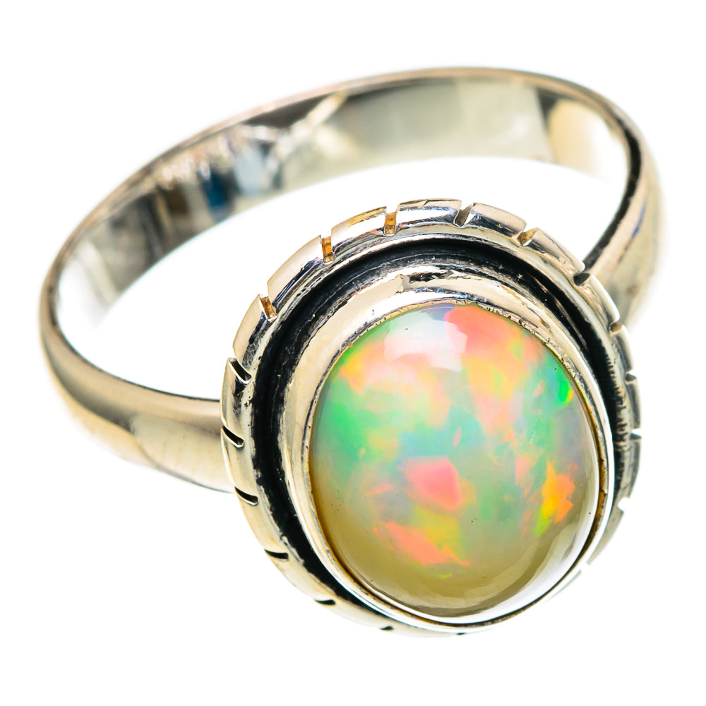 Sterling silver opal ring with oval opal, scalloped bezel and polished band
