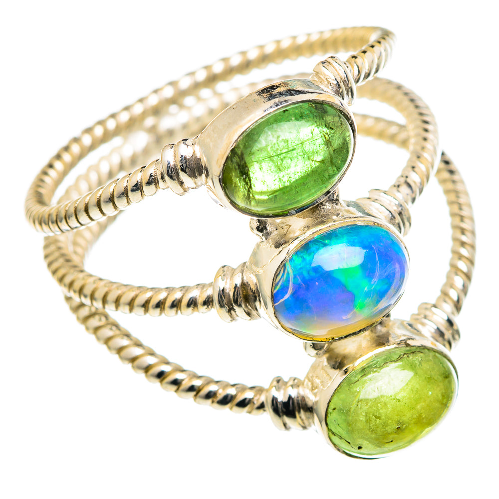 Sterling silver ring with oval green peridot and blue opal center, twisted rope shank