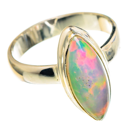 Oval iridescent opal set in polished sterling silver band, size 6.25