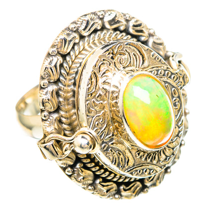 Oval Ethiopian opal set in ornate silver ring with textured rope band