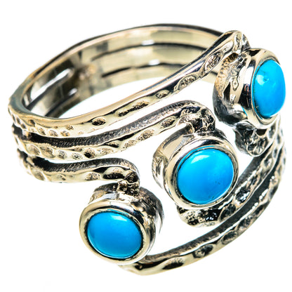 Turquoise cabochon silver ring with ornate swirl band and three blue stone settings