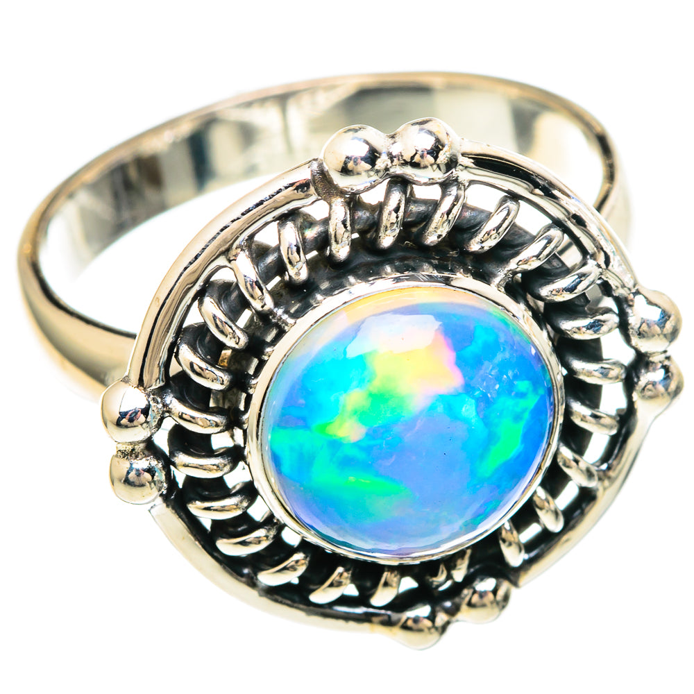 Sterling silver oval opal ring with beaded halo setting