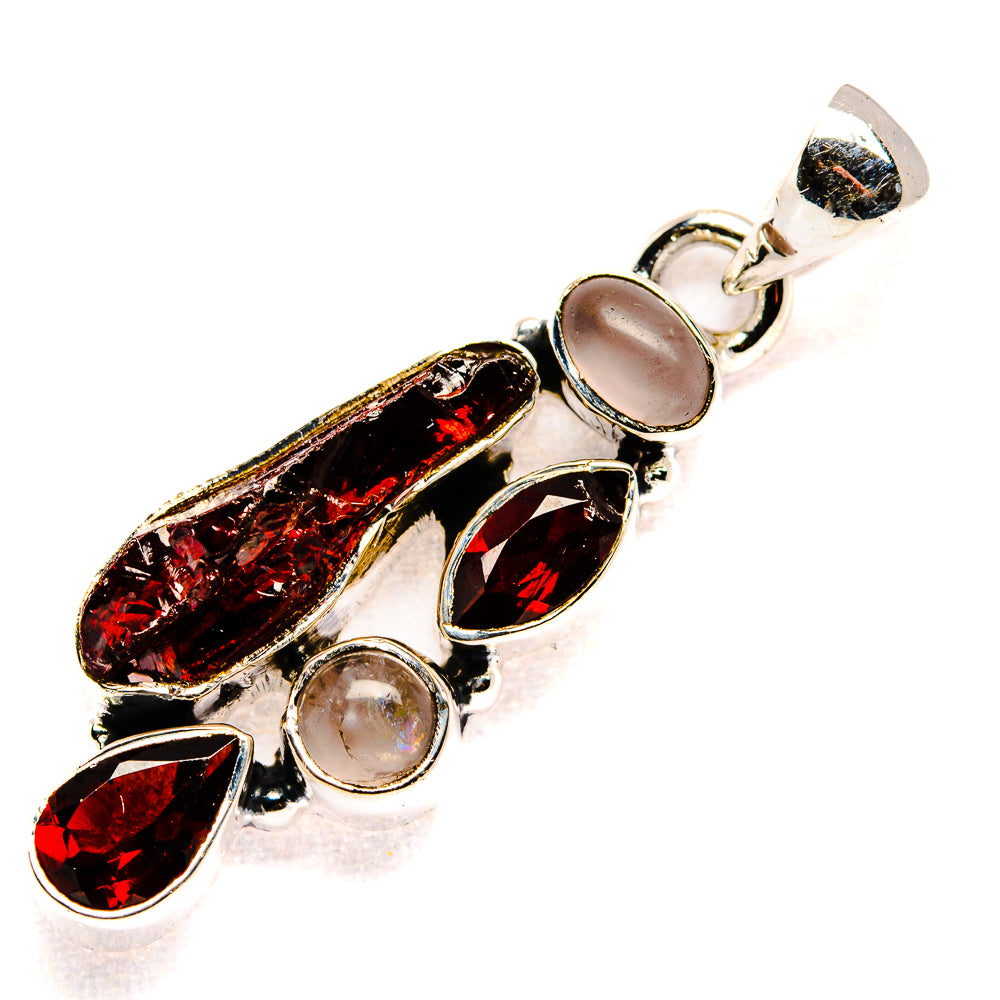 Sterling silver pendant with rough dark red garnet stones and pale pink oval accents