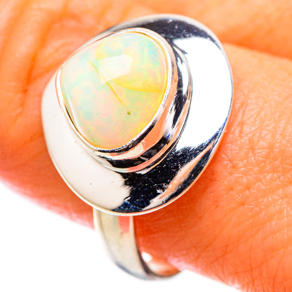 Sterling silver ring with oval iridescent Ethiopian opal center stone