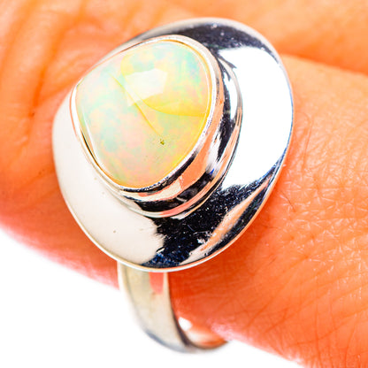 Sterling silver ring with oval iridescent Ethiopian opal center stone