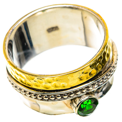 Gold-tone and sterling silver ring with green gemstone set on the front