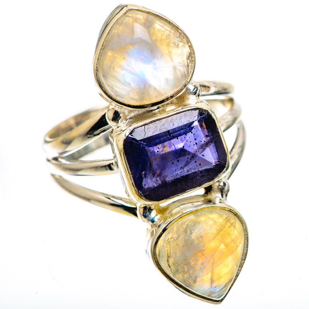 Silver ring with oval moonstone accents and a faceted dark blue square center stone