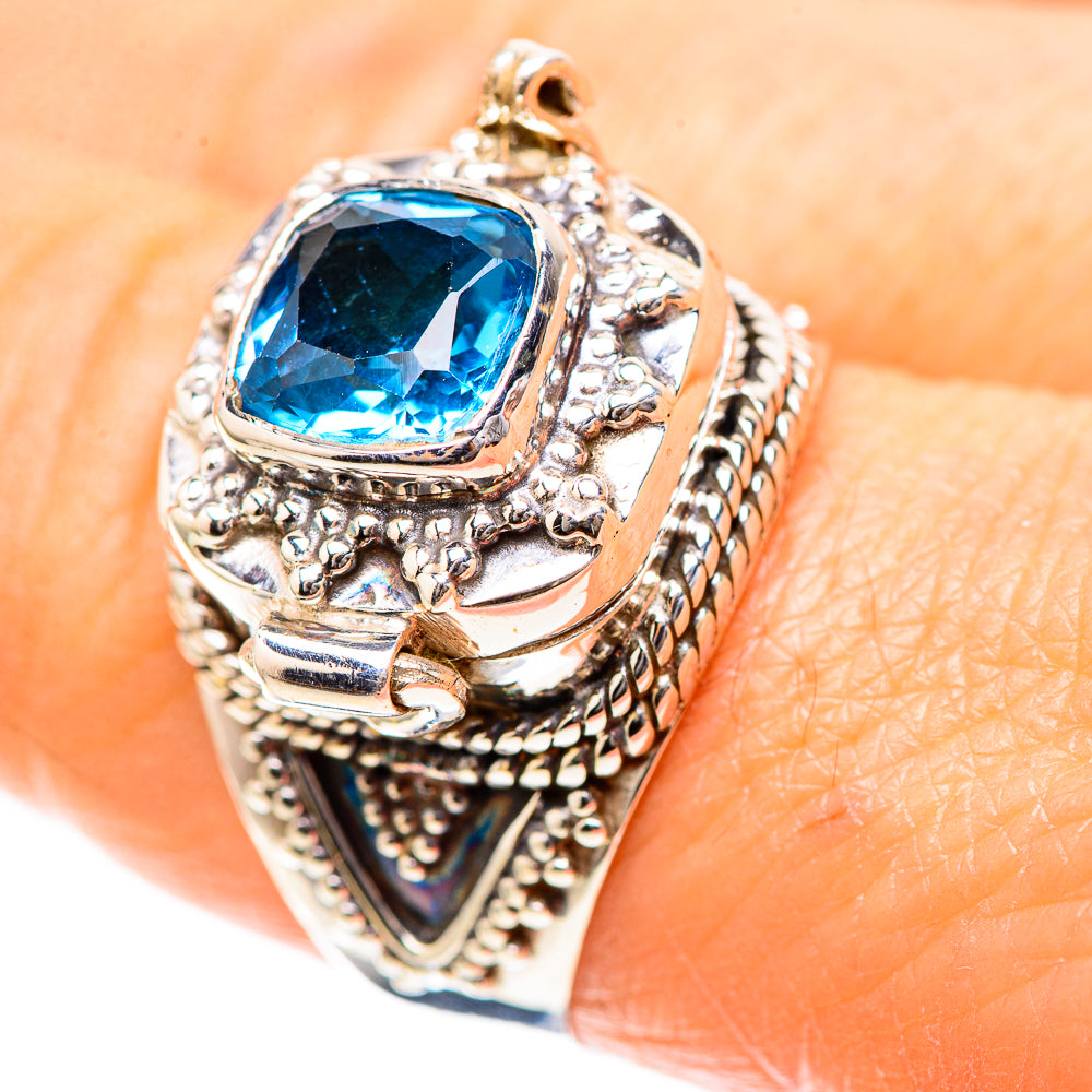 Sterling silver ring with blue topaz cushion gemstone and ornate filigree bezel