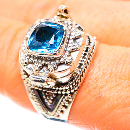 Sterling silver ring with blue topaz cushion gemstone and ornate filigree bezel