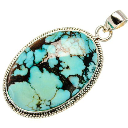 Turquoise oval pendant in sterling-silver bezel with loop bail, black veined blue stone