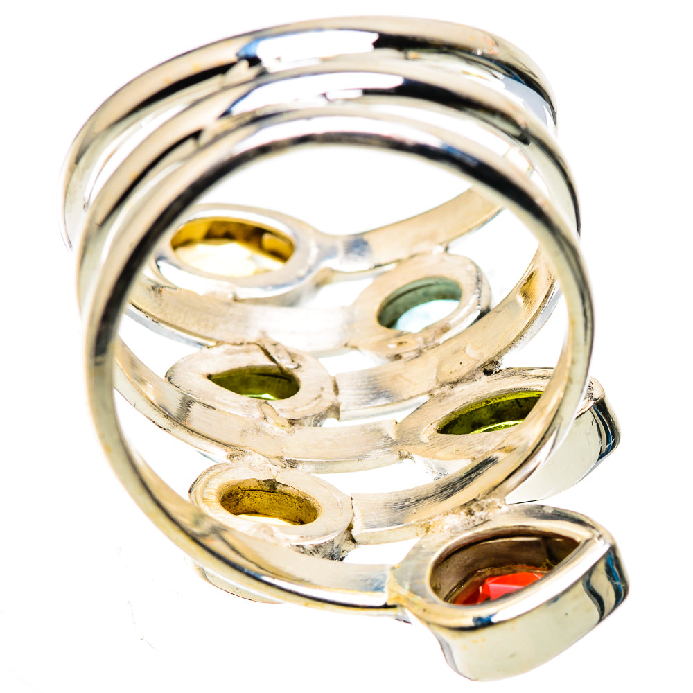 Silver ring underside view with oval yellow, green, and red stones set in metal