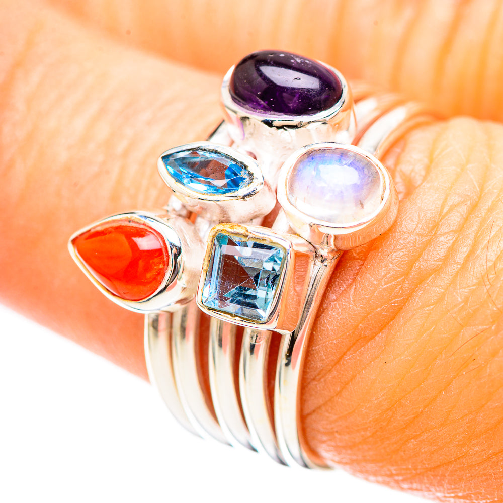 Sterling silver ring with purple, blue, opalescent and red gemstone settings