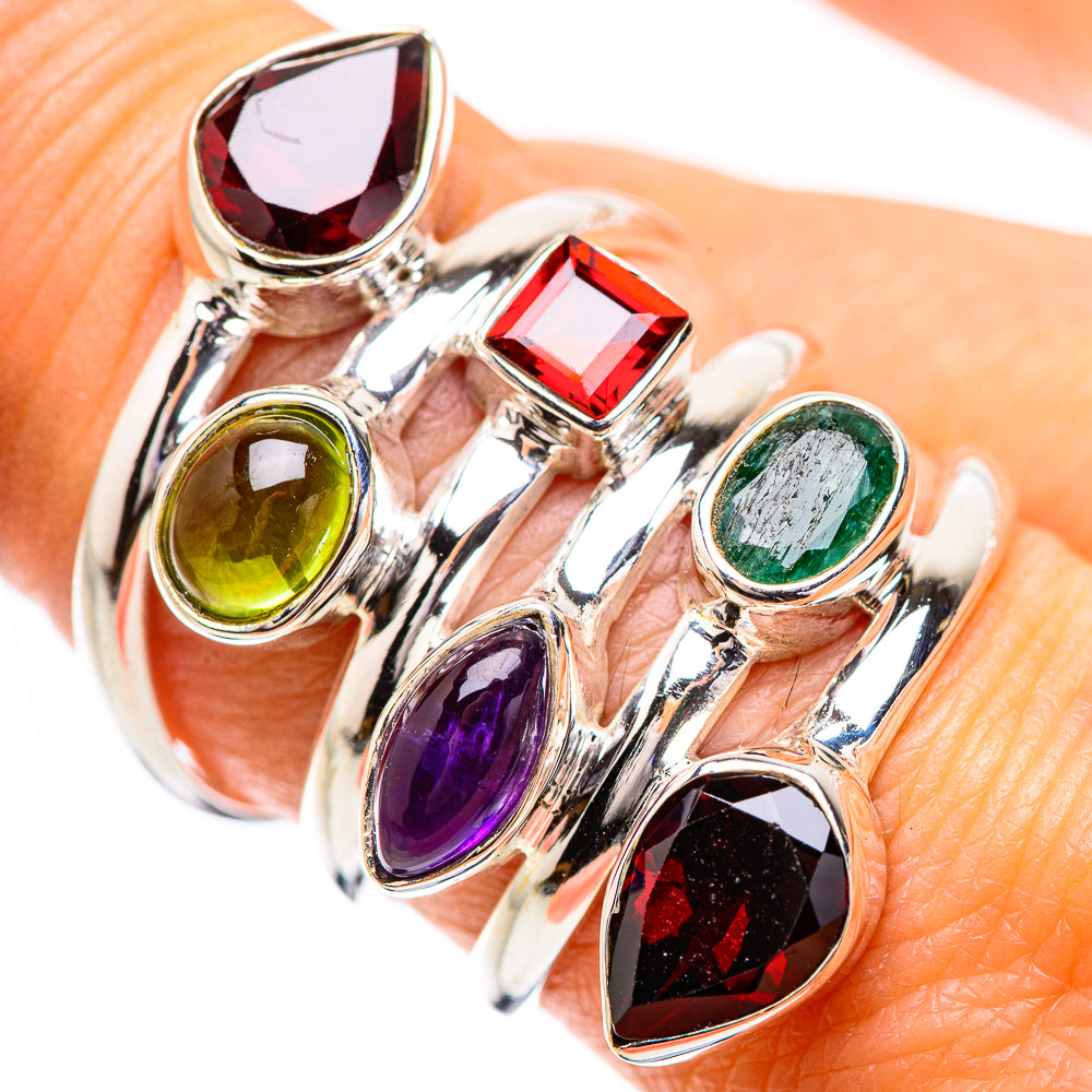 Multi-stone gemstone ring in silver with red, green, purple, and black accents