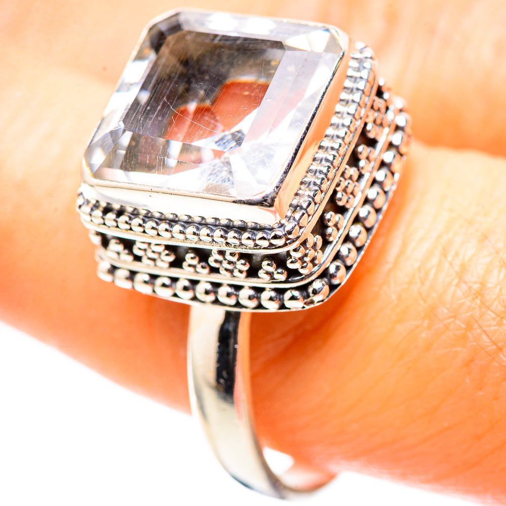 Sterling silver ring on finger with square clear quartz and beaded side accents