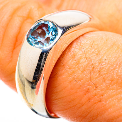 Sterling silver ring with oval blue topaz gemstone in a high bezel setting