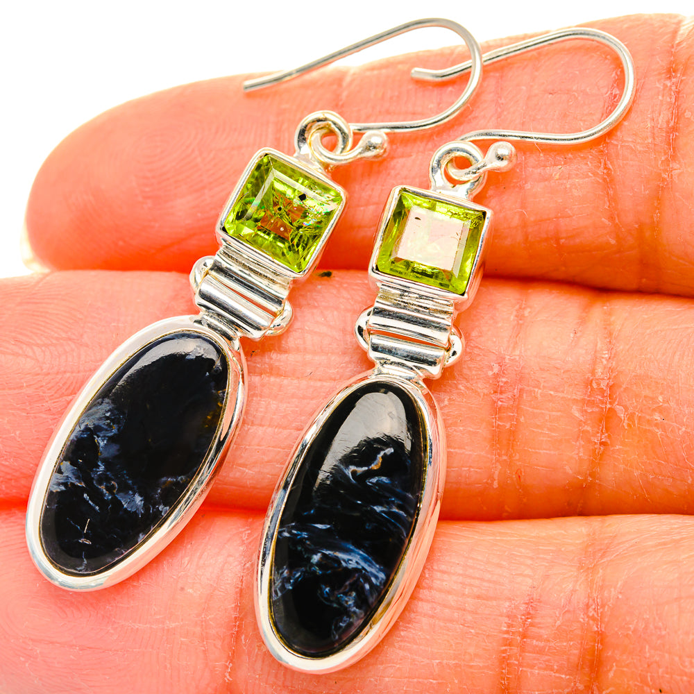 Silver drop earrings with green square tops and black oval teardrop stones