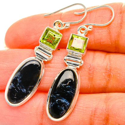 Silver drop earrings with green square tops and black oval teardrop stones