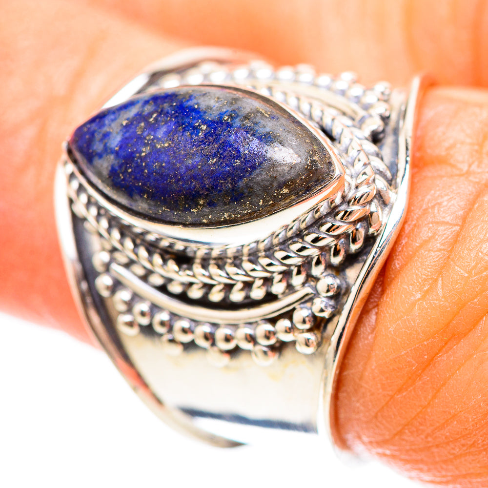 Sterling silver ring with blue lapis lazuli oval stone and detailed rope-style band