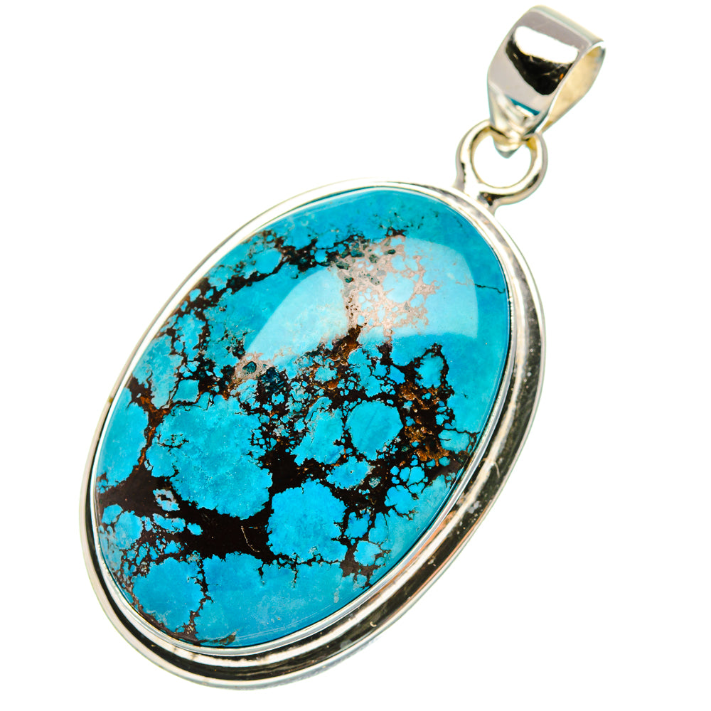 Oval turquoise pendant with black webbed matrix and sterling silver frame, full view.