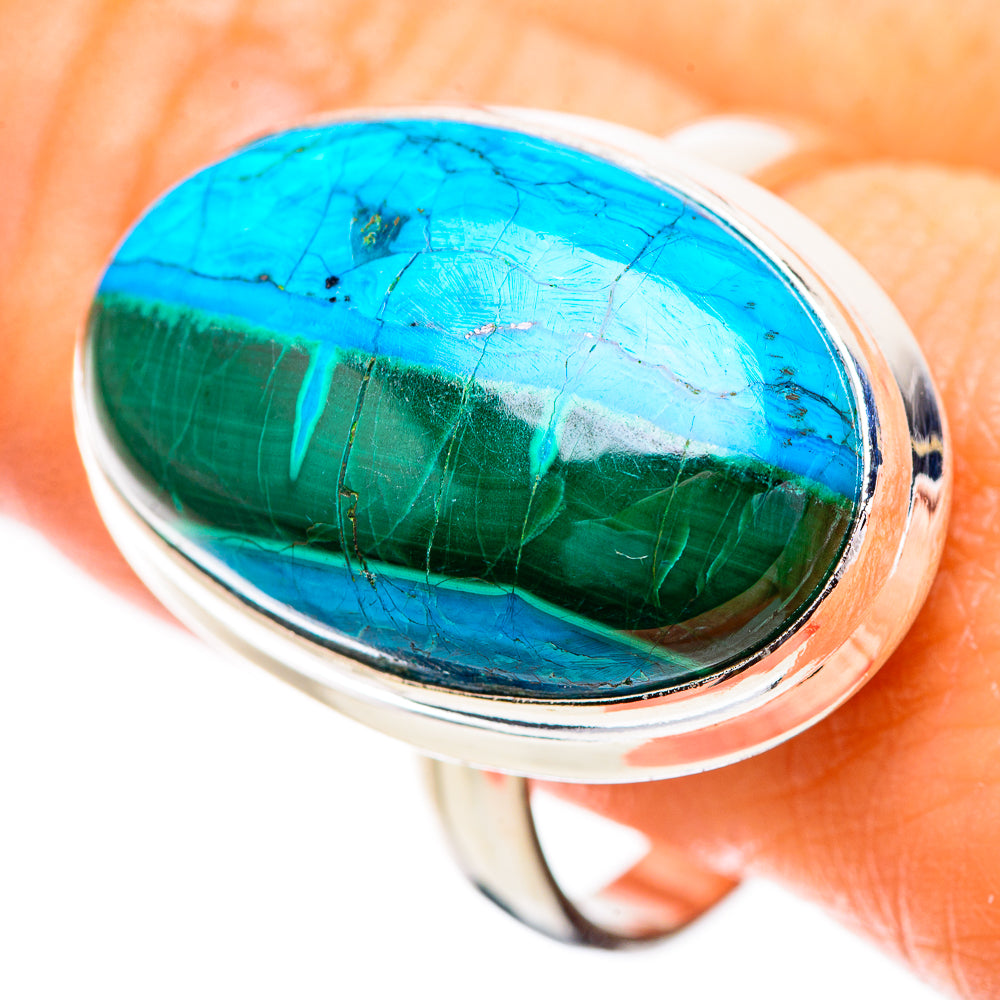 Sterling silver ring with oval blue-green cabochon stone, polished band