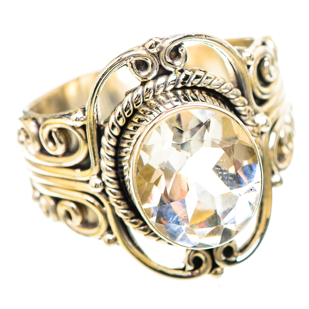 Sterling silver ring with large round white quartz, rope bezel and swirl details.