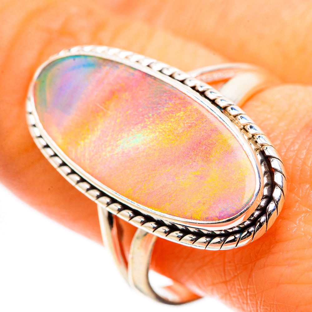 Oval iridescent opal ring in sterling silver bezel setting, size 10