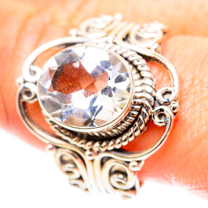 Sterling silver ring with ornate filigree and large round faceted white quartz.