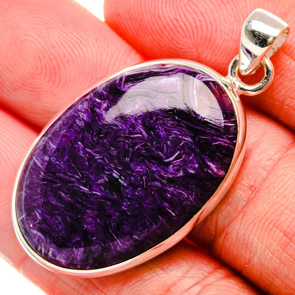Close-up teardrop charoite cabochon pendant in 925 sterling silver with round bail