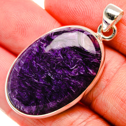 Close-up teardrop charoite cabochon pendant in 925 sterling silver with round bail