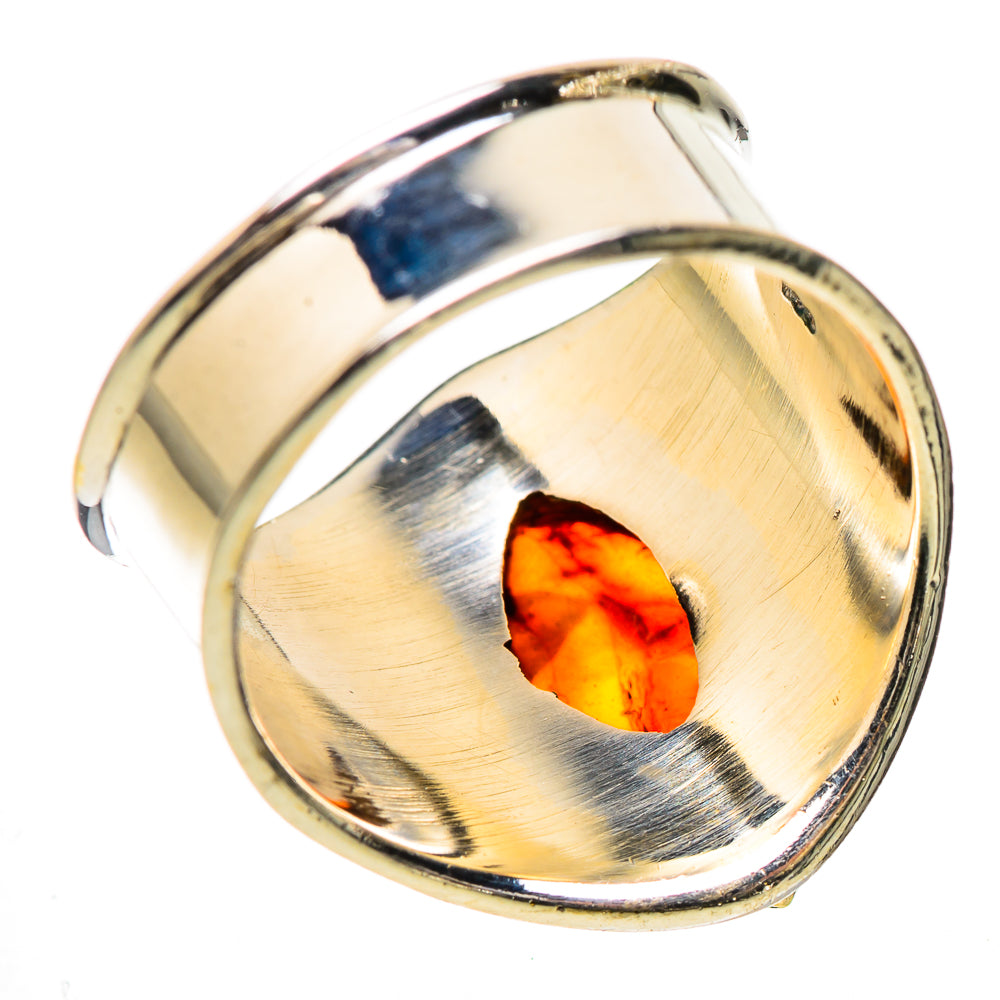 Sterling silver ring with oval amber cabochon and brushed gold-tone bezel detail