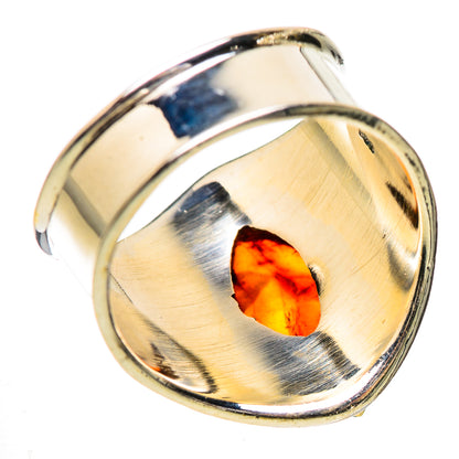 Sterling silver ring with oval amber cabochon and brushed gold-tone bezel detail