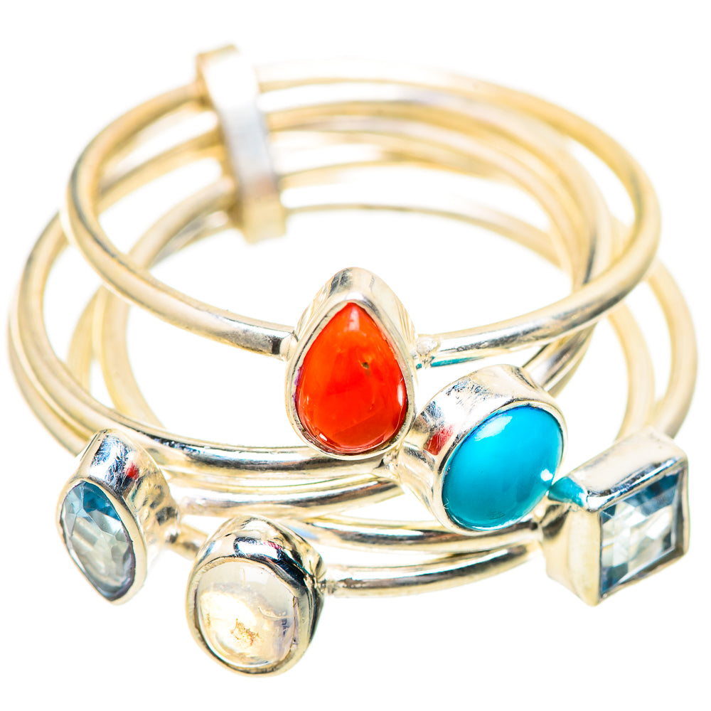 Silver-tone gemstone ring with red oval and blue oval stones, plus blue and clear accents