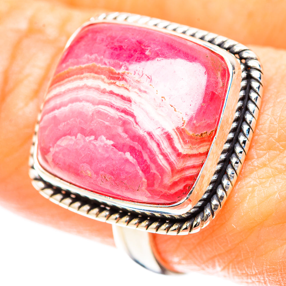 Sterling silver ring with pink rhodochrosite cabochon and white banded pattern, rope bezel