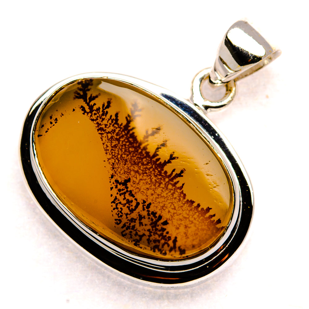Oval dendritic agate pendant with sterling silver bail; amber stone with dark dendrite lines