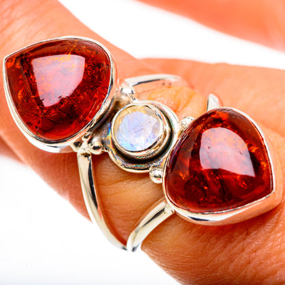 Silver ring with two pear amber gemstones and a round rainbow moonstone center