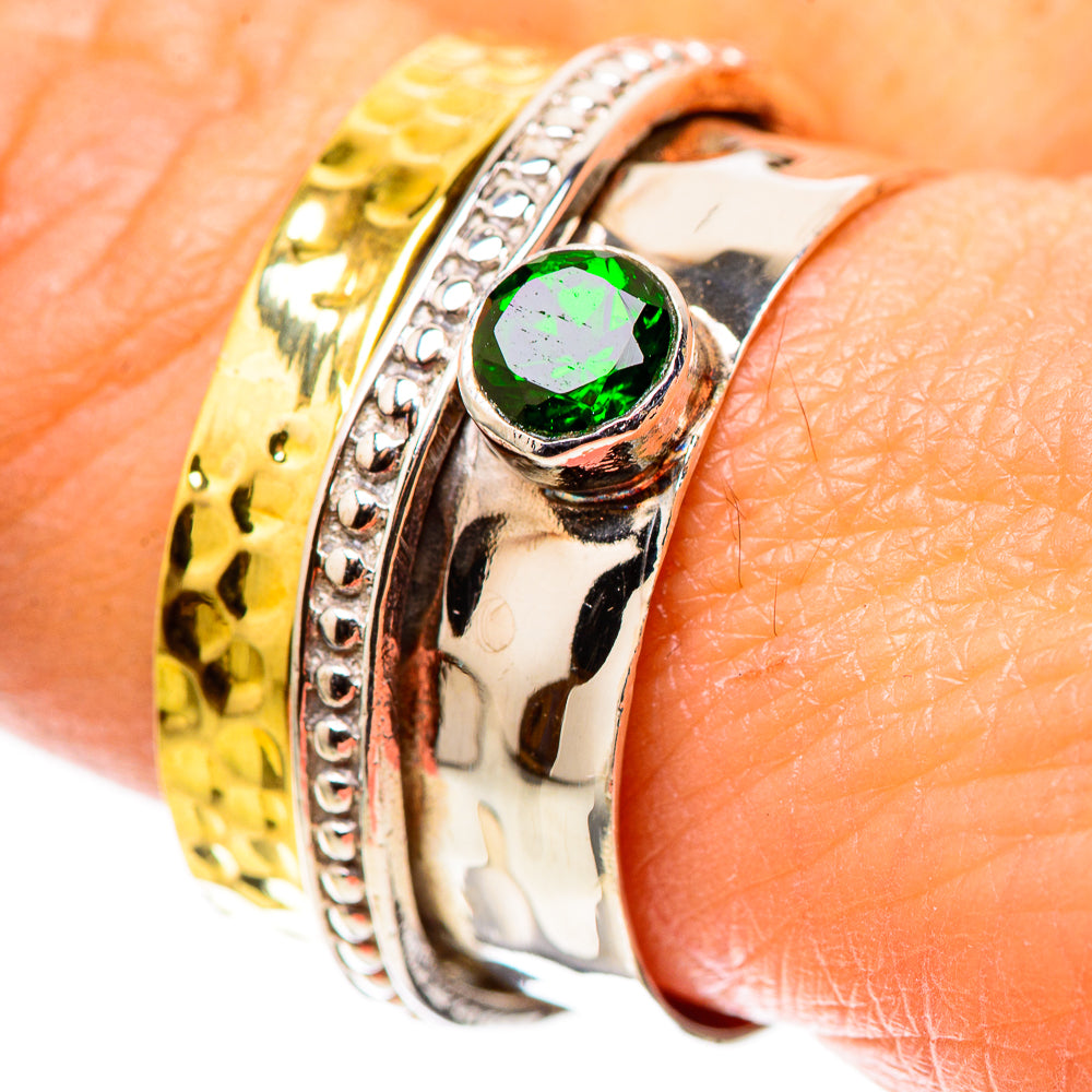 Sterling silver ring with green gemstone bezel and textured gold-tone band detail