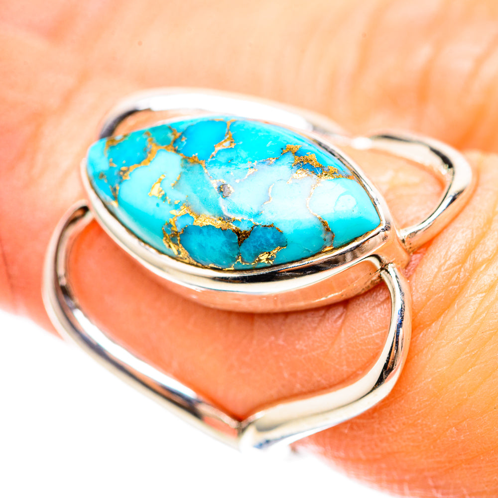 Turquoise oval cabochon sterling silver ring with gold matrix detail