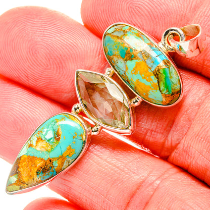 Sterling silver teardrop gemstone pendant with turquoise and gold-toned accents