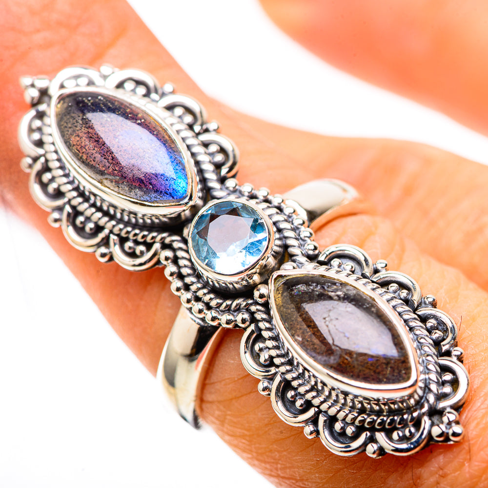 Silver ring with oval labradorite and blue topaz stones, ornate bezel setting