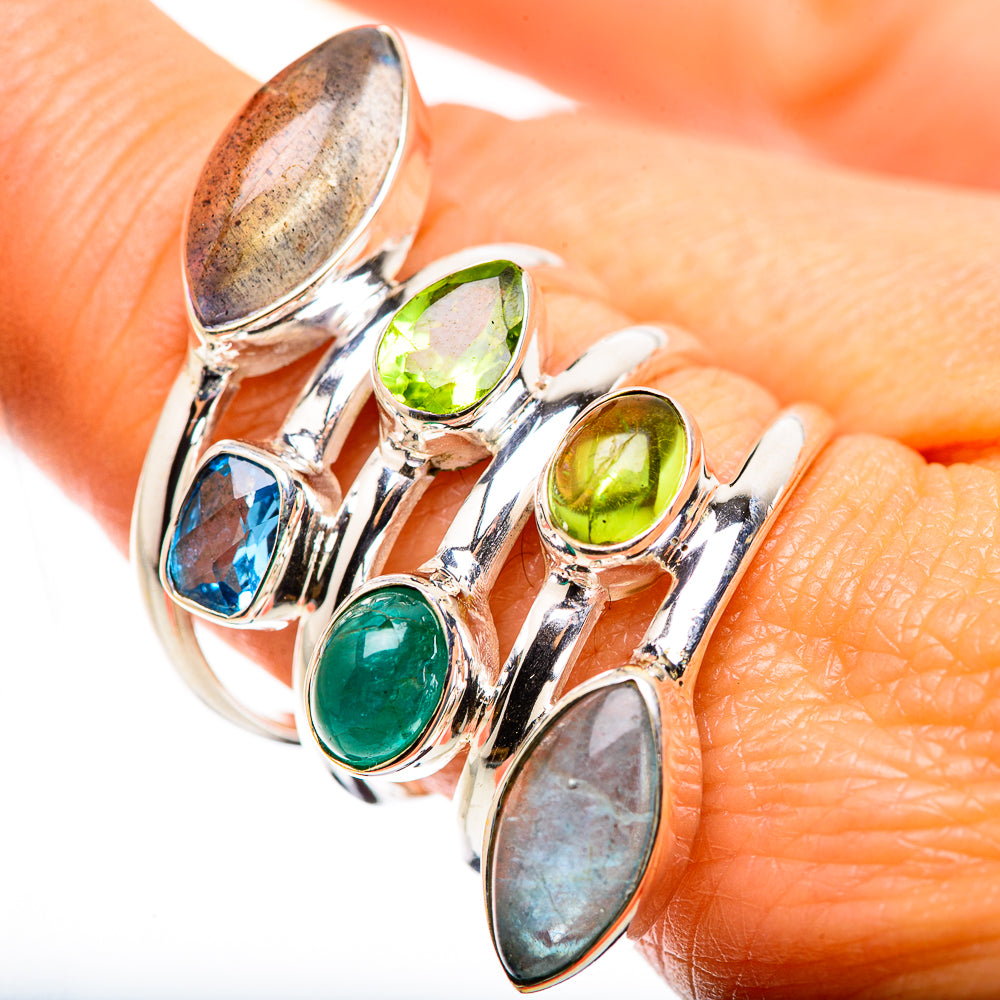 Silver gemstone ring with green, blue, and gray oval cabochons in bezel settings