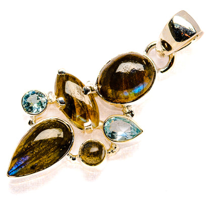 Sterling silver pendant with labradorite ovals and three blue topaz stones, bail