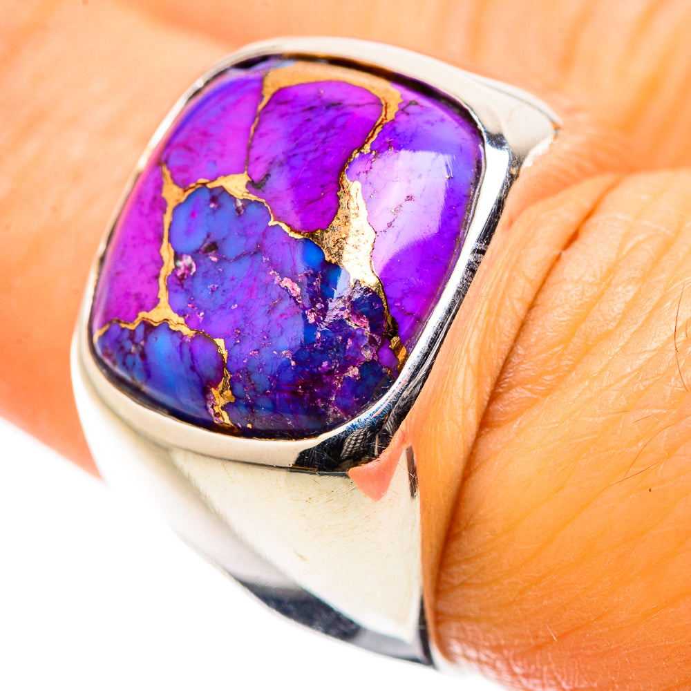 Sterling silver oval turquoise ring with vivid purple and blue stone on finger