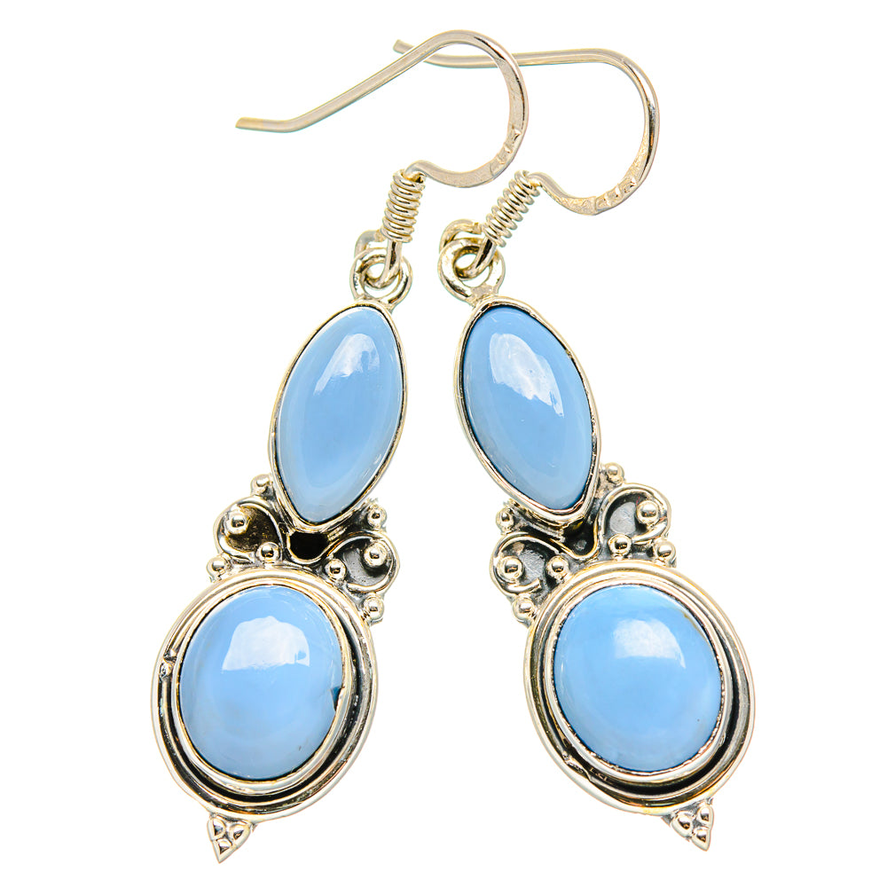 925 sterling silver opal drop earrings with light-blue oval stones and ornate teardrop detail.