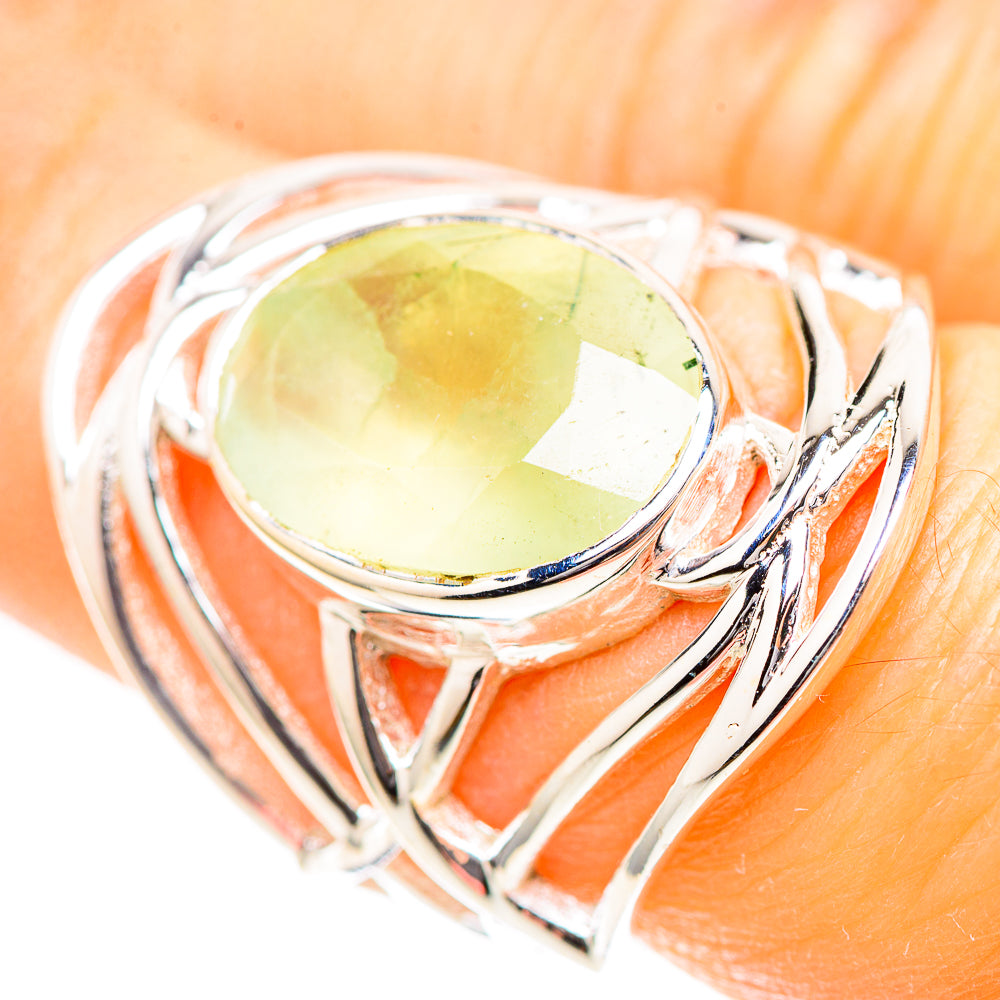Sterling silver ring close-up with oval pale green prehnite gemstone and braided rails