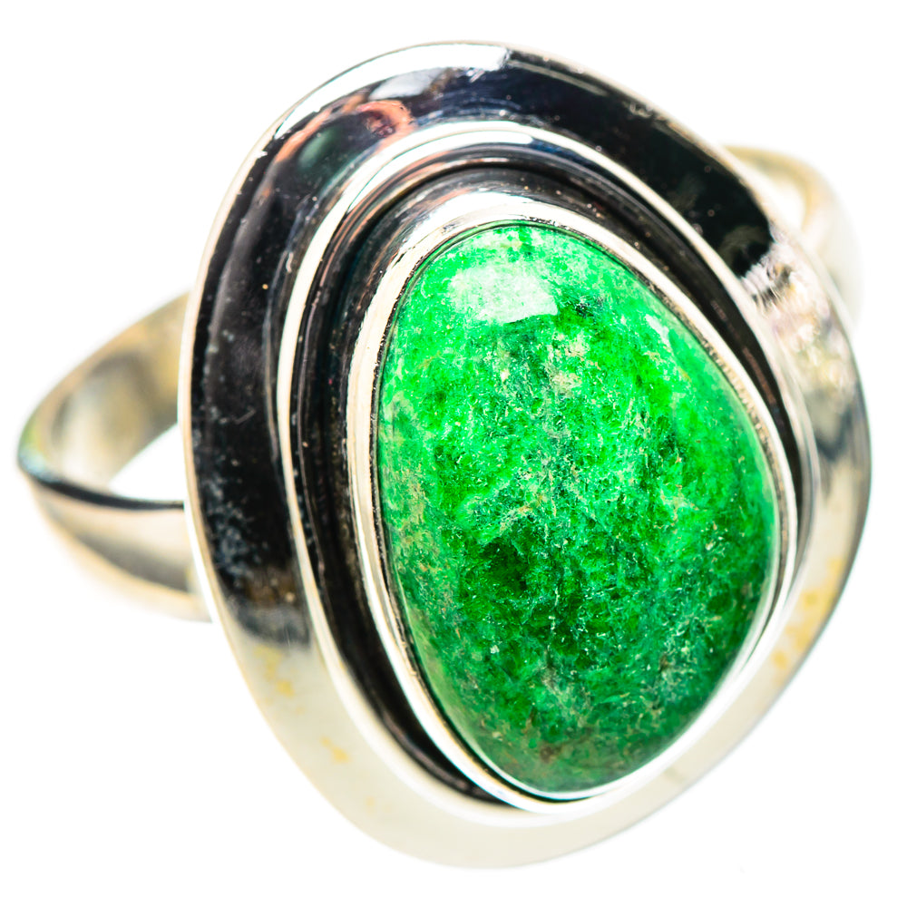 Sterling silver ring with oval green stone, dark bezel and polished metal band.