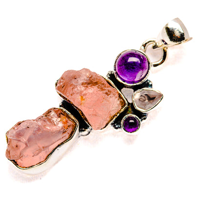 Sterling silver pendant featuring rough rose quartz stones and round amethyst with clear accents