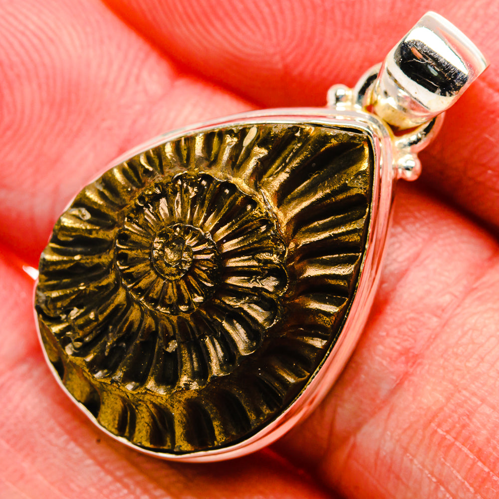 Pyrite fossil teardrop pendant, gold-tone sunburst detail on 925 sterling silver